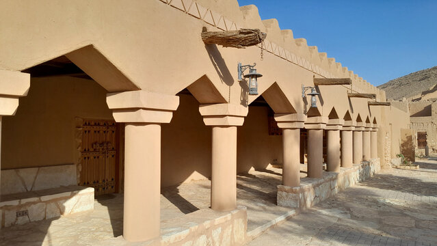 Traditional Najdi Liwan with Plastered Columns on Mud House Facade