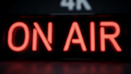 Closeup view of bright red neon on air sign - Powered by Adobe