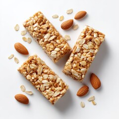 Energy bars with nuts and oats on white surface. Healthy food snack, cereal bars, nutrition, oats and almonds, natural energy, breakfast.