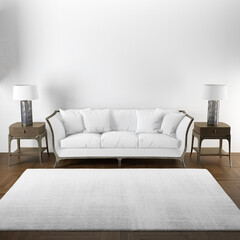 A cozy living room has a stylish white couch and two elegant lamps