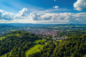 Obraz premium Aerial view of Bern, Switzerland showcasing the cityscape and surrounding green landscapes on a sunny day, Aerial view around the city Bern in Switzerland on a sunny day in summer