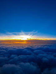 Sunset above the clouds.