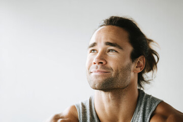 weightlifter resting with relaxed expression captured on left side of frame