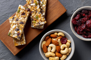 Healthy snack assortment with nut bars and dried fruits