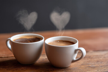 Cozy cups of coffee with heart-shaped steam rising at a cafe