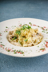 Creamy Mushroom Fettuccine Pasta on White Plate, Closeup