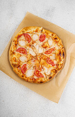 Pizza with pepperoni and chicken slices on crust