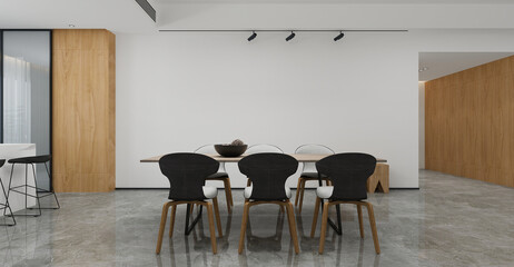 A dining room featuring a table, chairs, and a white wall decor