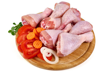 Raw chicken drumsticks, isolated on white background.