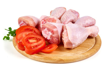 Raw chicken drumsticks, isolated on white background.