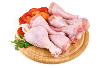 Raw chicken drumsticks, isolated on white background.