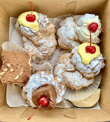 A box of fresh cream beautiful and delicious pastries
