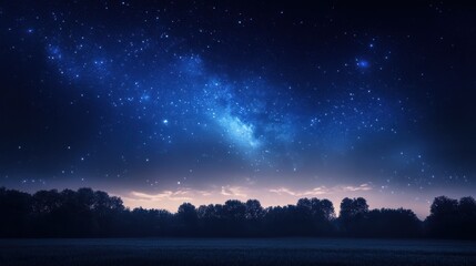 Fototapeta premium A vast, star-filled night sky over a field with trees silhouetted against the horizon. The Milky Way stretches across the sky, illuminating the landscape with a soft, ethereal glow.