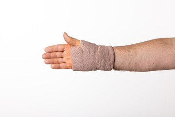 A Man's Hand and Wrist Wrapped In A Bandage