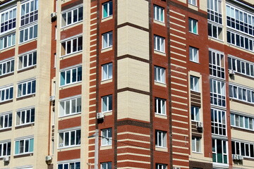 A multi-story brick building rises.