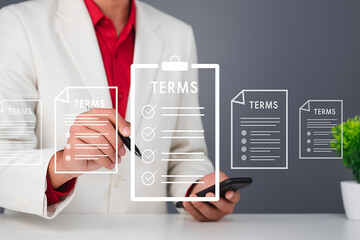 Professional Businessman Reviewing Terms Document on Smartphone with Holographic Interface in Office Environment – Corporate Technology Concept Image