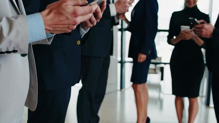 Dynamic visual sequence of smiling corporate executives texting and communicating via cellphones, portraying professionalism and business success - Powered by Adobe