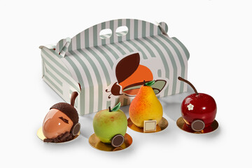 Fruit shaped desserts in front of pastry box from the braun family