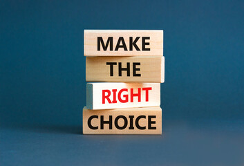 Make the right choice symbol. Concept words phrase Make the right choice on beautiful wooden blocks. Beautiful grey paper background. Business Make the right choice concept. Copy space.
