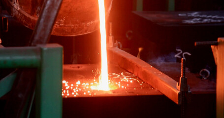 Metal melting in a metallurgical plant. Sparks from melting steel.