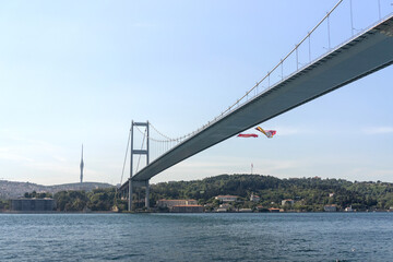 Obraz premium Turkey, Istanbul, houses below Fatih Sultan Mehmet Bridge on Bosphorus Strait