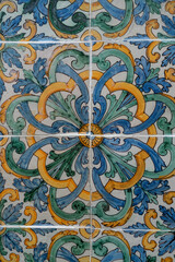 Handmade old Turkish Blue ceramic Tiles on the wall in Istanbul City, Turkey. Close up. Ancient Ottoman patterned Iznik syle design tile composition. Flower patterns on ceramic tiles