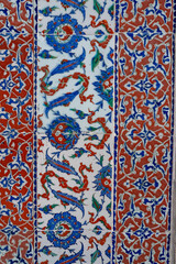 Handmade old Turkish Blue ceramic Tiles on the wall in Istanbul City, Turkey. Close up. Ancient Ottoman patterned Iznik syle design tile composition. Flower patterns on ceramic tiles