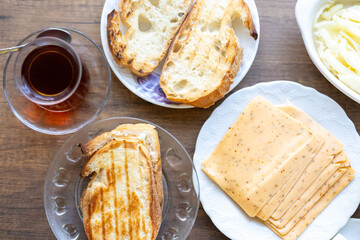 Turkish style breakfast: eggs, chechil cheese, white cheese, kashar cheese and Turkish tea
