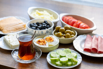 Turkish style breakfast: eggs, chechil cheese, white cheese, kashar cheese and Turkish tea