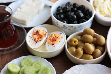 Turkish style breakfast: eggs, chechil cheese, white cheese, kashar cheese and Turkish tea
