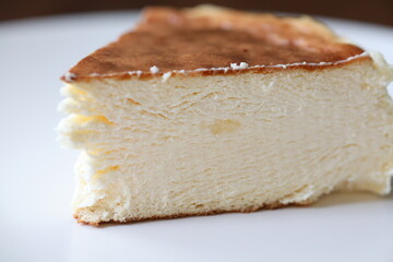 San Sebastian cheesecake on plate in restaurant in close-up	
