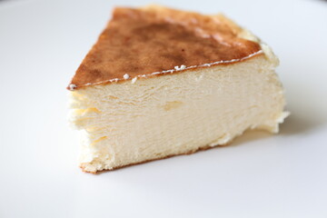 San Sebastian cheesecake on plate in restaurant in close-up	