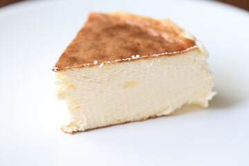 San Sebastian cheesecake on plate in restaurant in close-up	