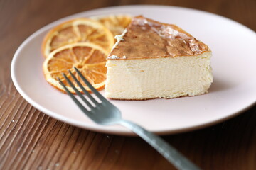 San Sebastian cheesecake on plate in restaurant in close-up	