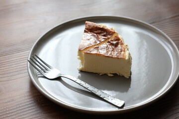 San Sebastian cheesecake on plate in restaurant in close-up	