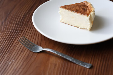 San Sebastian cheesecake on plate in restaurant in close-up	