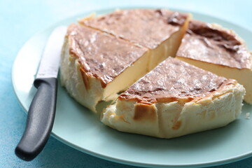 San Sebastian cheesecake on plate in restaurant in close-up	
