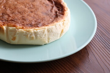 San Sebastian cheesecake on plate in restaurant in close-up	