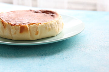 San Sebastian cheesecake on plate in restaurant in close-up	