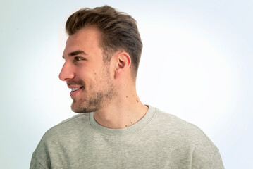 Fototapeta premium Headshot of a young man standing against isolated background