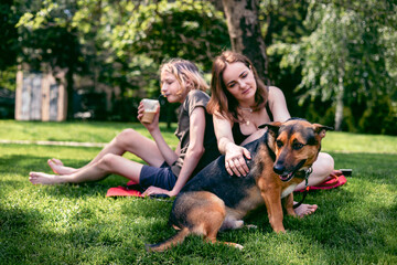 Park, mother and boy with dog, smile and sunshine with weekend break, happiness and nature. Family,...
