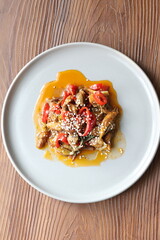 Close-up Asian style mushroom dish with sesame seeds