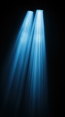 Dramatic lighting illuminating darkness, stage spotlights with light rays, glow shining down from above, light beams, copy space