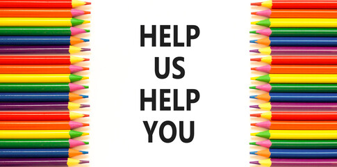 Help you symbol. Concept words phrase Help us help you on beautiful white paper. Colored pencils....