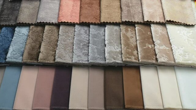 Furniture textiles for the interior of the house. Samples of soft upholstery fabrics. a close-up view of the catalog. a cozy collection of velour and boucle textile fabrics for furniture