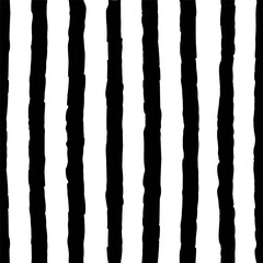 Seamless pattern with hand drawn chalk textured vertical lines. Contrast background with sketchy scribble stripes in black and white colors. Abstract vector seamless wallpaper