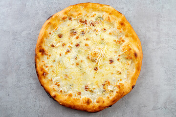 Warm pizza showcases a perfectly baked golden crust topped with gooey melted cheese. The inviting aroma fills the kitchen, promising a delightful culinary experience. Perfect for sharing and savoring