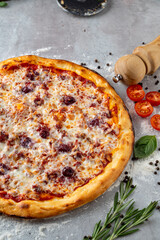 Warm and inviting, this pizza boasts a golden crust topped with melted mozzarella cheese, herbs, and fresh tomatoes. Perfect for a cozy meal at home, this dish captures the essence of comfort food