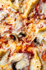 Savory cheese pizza, adorned with hearty artichokes and fresh mushrooms, bakes in a golden crust, tempting taste buds during a cozy meal time