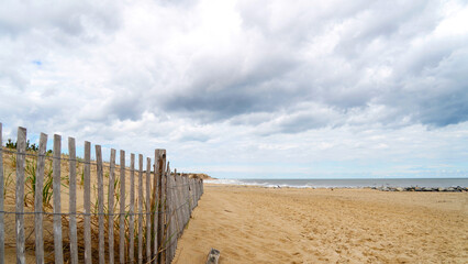 wooden fence on the beach